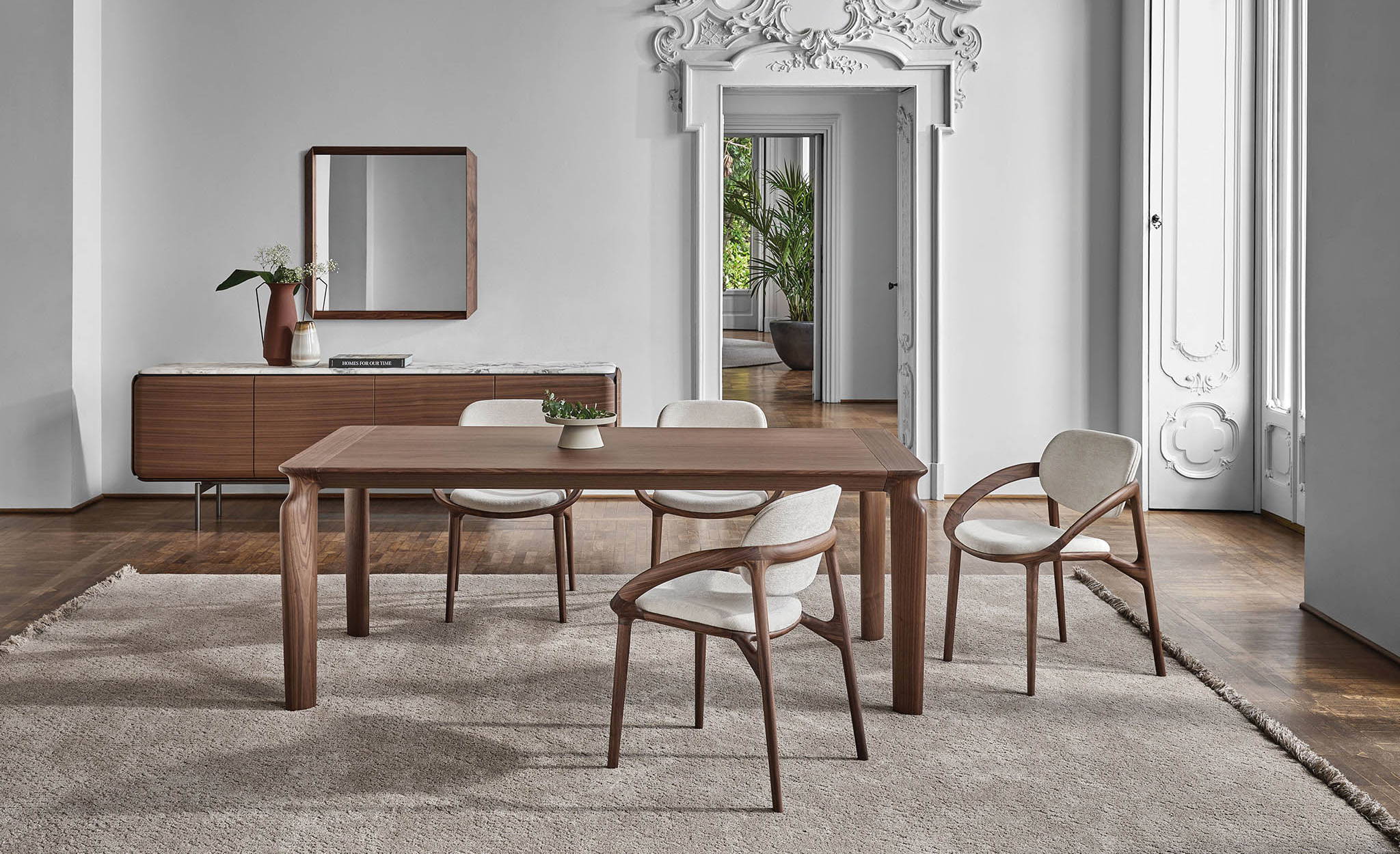 The amphora extension dining table and the pebble sideboard